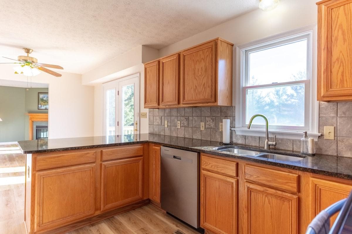 Open to the gathering space, yet keeping the messy prep work where it belongs.
